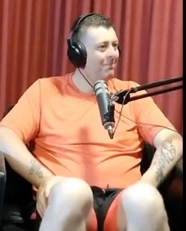 Podcast guest speaking into a microphone